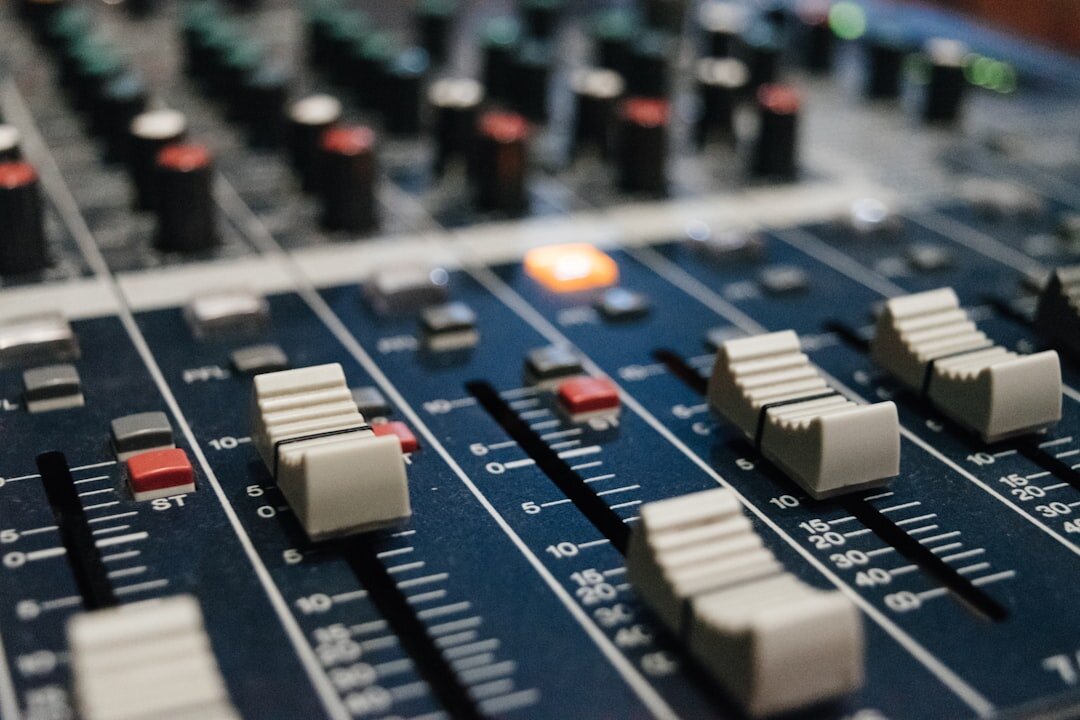 Broadcast mixing console with sliders and buttons