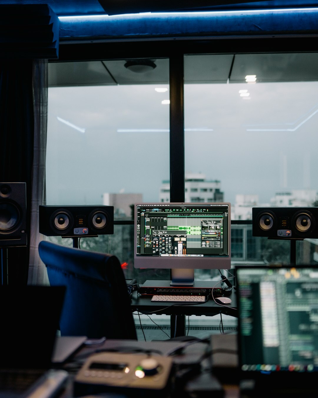 Broadcast studio control room with multiple video monitors